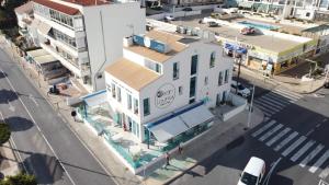 an overhead view of a white building on a city street at Ocean Lounge in Altea