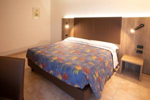 Postel nebo postele na pokoji v ubytování Residence Meridiana