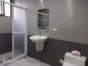 a bathroom with a sink and a toilet at Soul Home in Jiaoxi