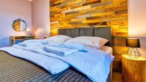 Ένα ή περισσότερα κρεβάτια σε δωμάτιο στο Apartamenty przy Gondoli - Źródlana 2 by Royal Aparts