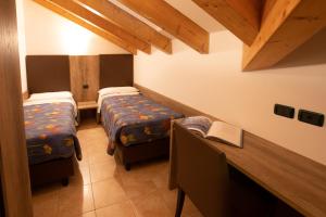 Postel nebo postele na pokoji v ubytování Residence Meridiana
