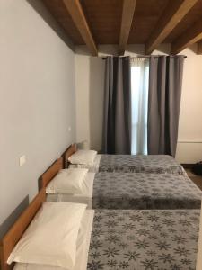 A bed or beds in a room at IL Borgo