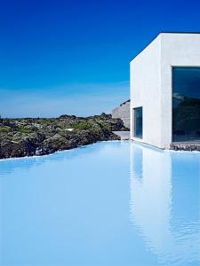 a pool of water in front of a building at Silica Hotel at Blue Lagoon Iceland in Grindavík