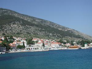 a small town on a hill next to the water at Villa Jasmin in Bol