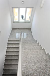 a staircase in a building with a window at Apartment Village Nin in Nin