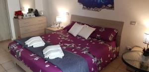 Postel nebo postele na pokoji v ubytování B&B Pierilu'