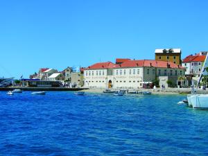 a group of boats in the water in front of buildings at Villa Jasmin in Bol
