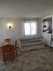 A bed or beds in a room at Dafne's Beach