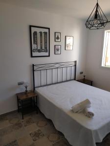 A bed or beds in a room at Dafne's Beach