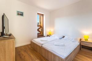 Postel nebo postele na pokoji v ubytování Mountain Apartment Panorama Klinovec