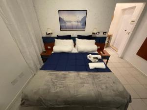 Postel nebo postele na pokoji v ubytování Albergo Villa Marina
