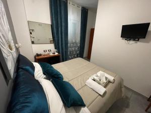 TV a/nebo společenská místnost v ubytování Albergo Villa Marina