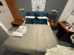 Postel nebo postele na pokoji v ubytování Albergo Villa Marina