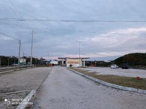 an empty street with a building on the side of a road at São Pedro de Moel by Campigir in São Pedro de Moel