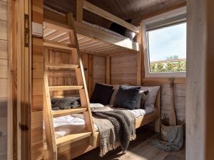 a bunk bed in a tiny house at CAMP NORD RESORT in Mielno