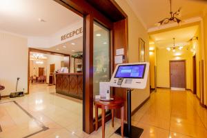 a hospital lobby with a computer on a table at Hotel Giovanni Giacomo in Teplice