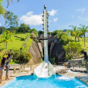 a water slide in a pool at a theme park at ALDEIA DAS ÁGUAS PARK RESORT in Barra do Piraí