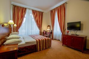 Postel nebo postele na pokoji v ubytování Hotel Giovanni Giacomo + 37 fotografií