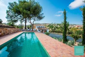 an image of a swimming pool in a villa at VILLA TOSCANA in Benissa