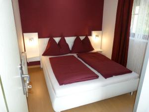 A bed or beds in a room at Ferienhaus Blümel inkl. freier Strandbadeintritt