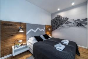 Posteľ alebo postele v izbe v ubytovaní Aparthotel Giewont