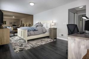 a bedroom with a bed and a living room at Luray Terrace in Portland