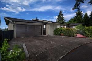 a house with a garage and a driveway at Luray Terrace in Portland
