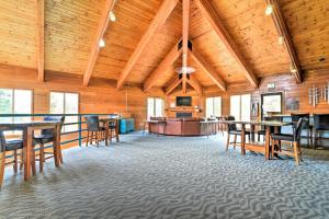 a large room with wooden ceilings and tables and chairs at Mtn-View Gem with Community Perks in Silverthorne! in Silverthorne