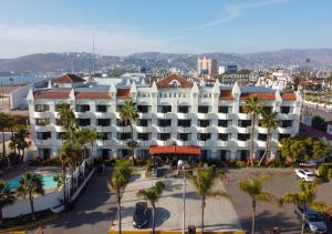 an aerial view of a hotel with palm trees at Corona Hotel & Spa in Ensenada