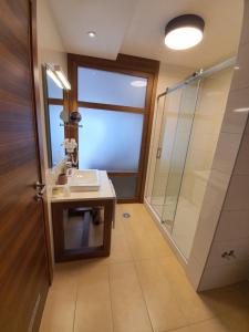 a bathroom with a sink and a shower at Apartment B331 - Aparthotel Vucko Private host in Jahorina +8 photos