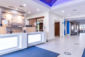 a lobby of a store with two large windows at Holiday Inn Express Hereford, an IHG Hotel in Hereford