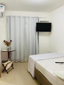 Μια τηλεόραση ή/και κέντρο ψυχαγωγίας στο Pousada Wall Paraíso