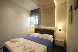 Postel nebo postele na pokoji v ubytování Deluxe Apartments Andreas