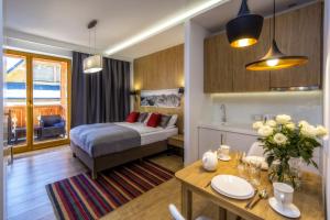 Posteľ alebo postele v izbe v ubytovaní Aparthotel Giewont