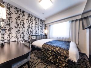 Postel nebo postele na pokoji v ubytování APA Hotel Shinagawa Togoshi Ekimae