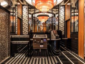 a lobby with a desk and a fax machine in it at APA Hotel Shinagawa Togoshi Ekimae in Tokyo