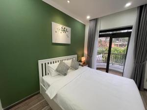Voodi või voodid majutusasutuse Memory Inn - Green Villa toas