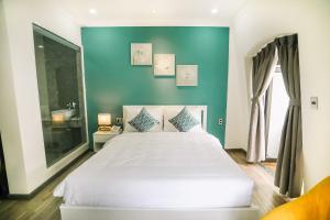 Voodi või voodid majutusasutuse Memory Inn - Green Villa toas
