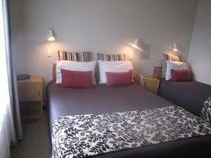 Ένα ή περισσότερα κρεβάτια σε δωμάτιο στο Buller Court on Palmerston