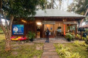 a small building with a statue in front of it at Sea Shell Resort & Spa, Havelock in Havelock Island