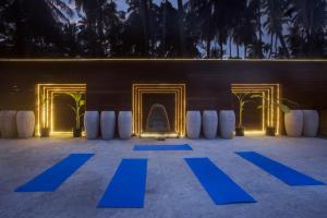 a group of blue mats in front of a building at Sea Shell Resort & Spa, Havelock in Havelock Island