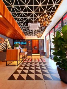 a lobby with a black and white checkered floor at Sovotel @ USJ 9 in Subang Jaya