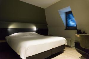 Een bed of bedden in een kamer bij Hotel Central