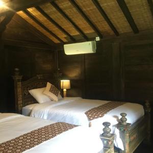 Postel nebo postele na pokoji v ubytování Alas Arum Ecolodge