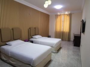 Postel nebo postele na pokoji v ubytování Address hotel Apartments العنوان للشقق الفندقية