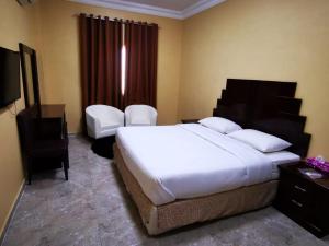 Postel nebo postele na pokoji v ubytování Address hotel Apartments العنوان للشقق الفندقية