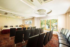 a conference room with chairs and a table in the background at Sea Shell Port Blair in Port Blair