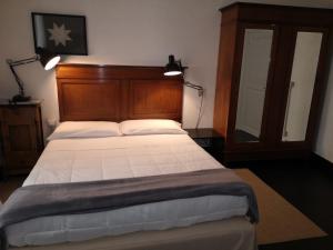 Postel nebo postele na pokoji v ubytování Palazzo Melfi
