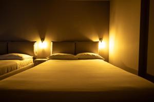 Posteľ alebo postele v izbe v ubytovaní Dannunziano Aparthotel