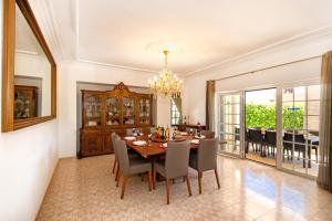 a dining room with a table and chairs at Villa Morais by Algarve Vacation in Guia